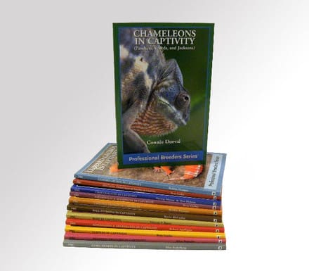 A stack of books with the cover of champions in captivity.