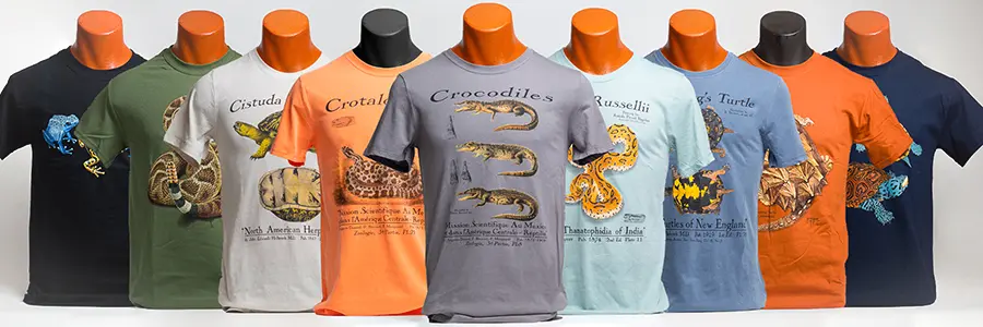 A group of four t-shirts with different designs on them.