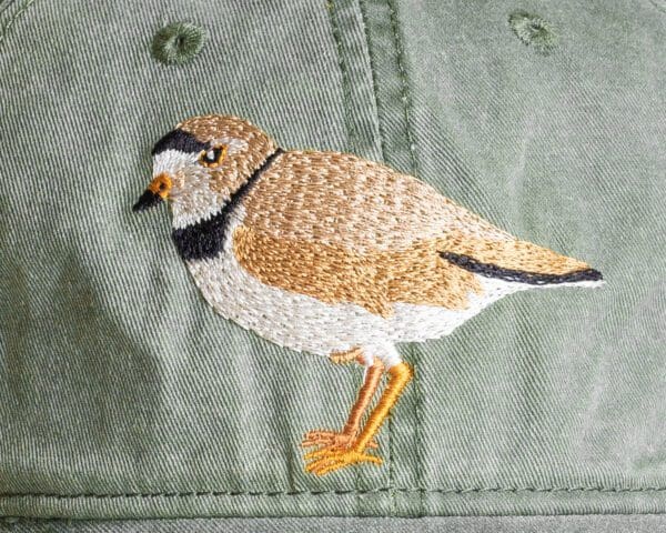 A close up of the bird embroidered on a hat