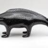 A black and white animal sculpture on top of a table.