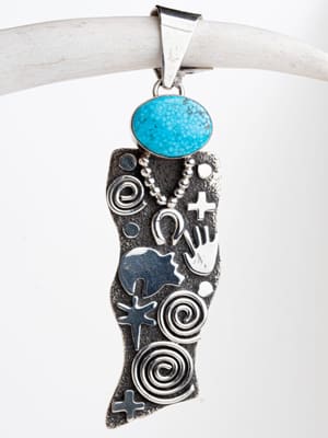 A silver necklace with a blue stone on it.