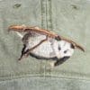A baseball cap with an animal on it.