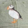 A close up of the bird on the hat