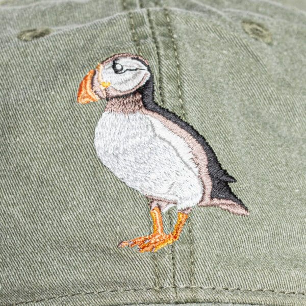 A close up of the bird on the hat