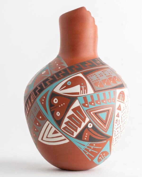 A close up of the side of an artistic vase