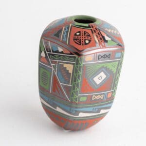 A colorful vase with geometric designs on it.