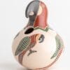 A bird shaped vase with a colorful design on it.
