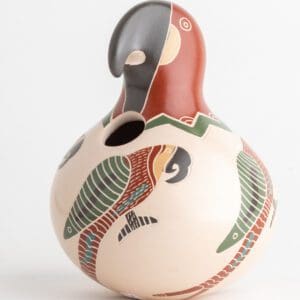 A bird shaped vase with a colorful design on it.