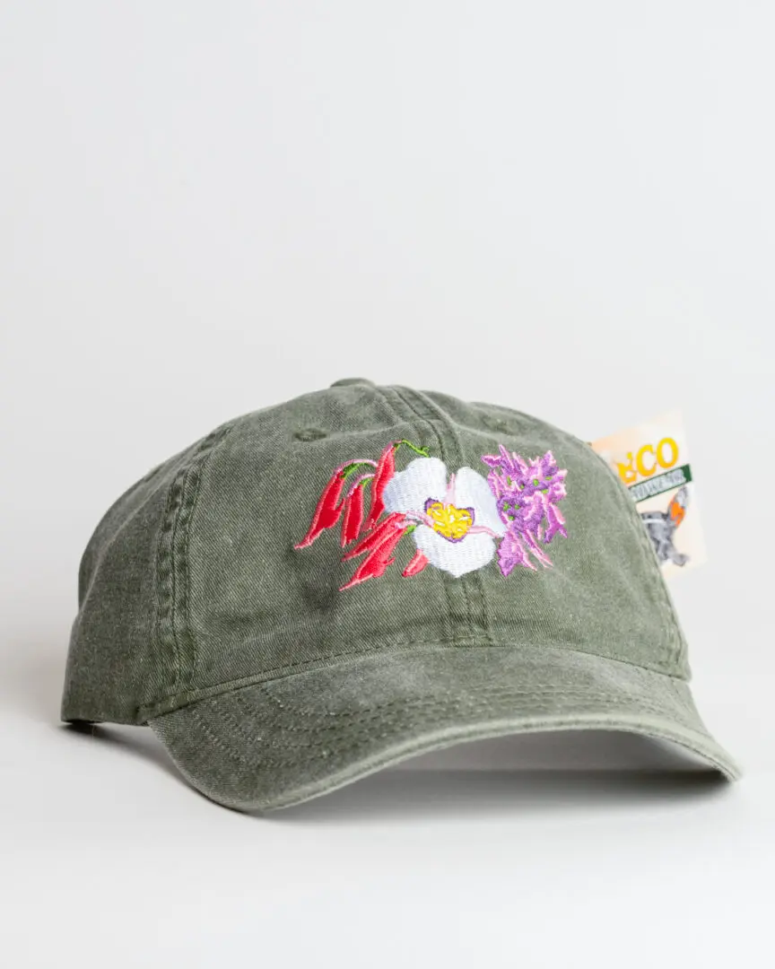 A green hat with flowers on it.