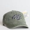 A baseball cap with an image of a snake on it.