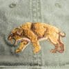 A close up of the bear embroidered on a hat