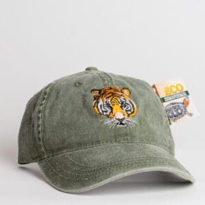 A green hat with an embroidered tiger on it.