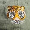 A close up of the tiger 's face on a hat