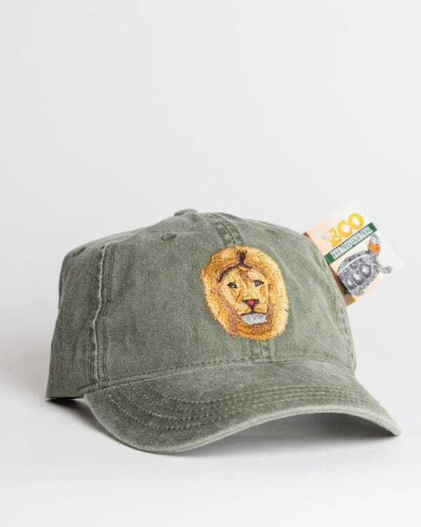 A green hat with an image of a lion on it.