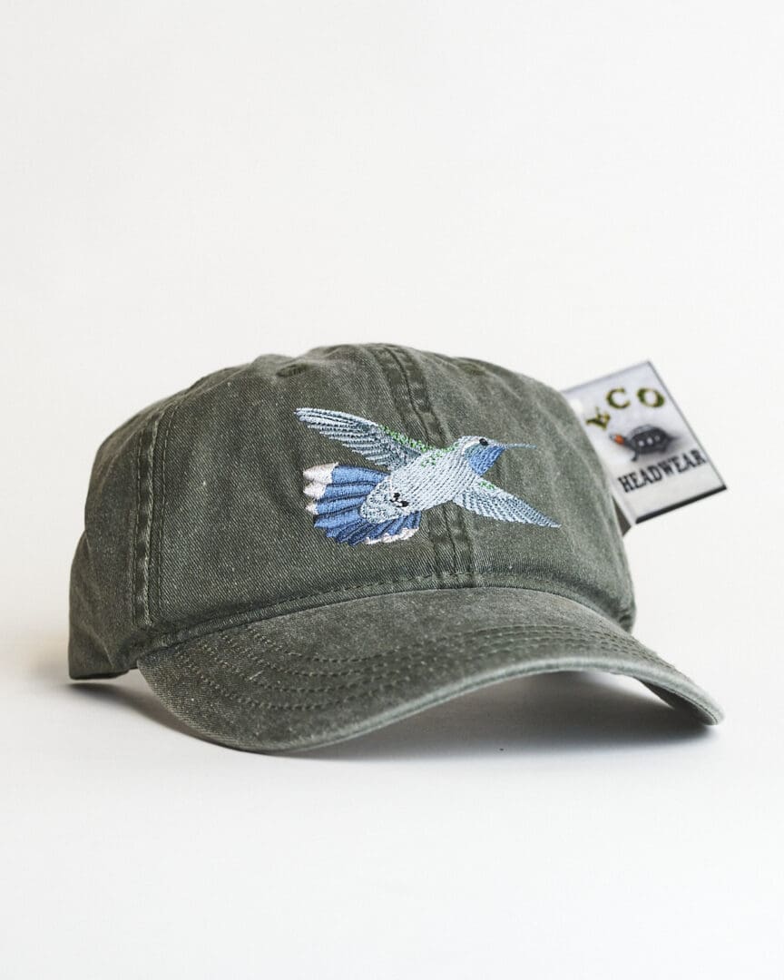 A hat with a bird on it is shown.