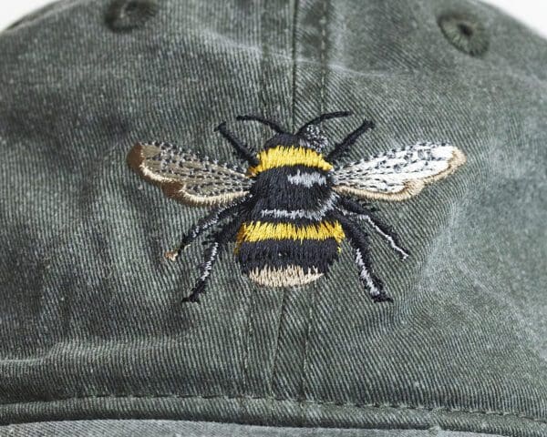 A close up of the bee on a hat