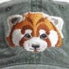A close up of the face of a red panda