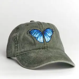 A green hat with a blue butterfly on it.