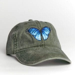 A green hat with a blue butterfly on it.